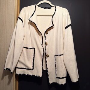 Elegant Cream Cardigan with Black Trim